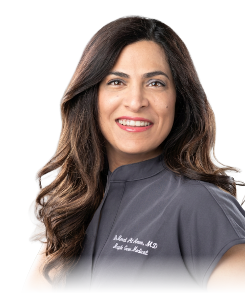 Dr. Meral Al-Ameer smiling in white coat holding clipboard and pen